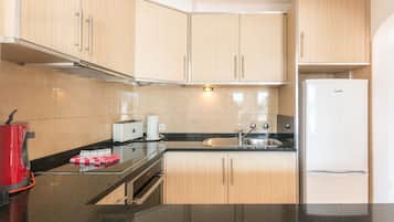 Standard Apartment, 2 Bedrooms, Pool View | Private kitchenette | Fridge, microwave, oven, stovetop