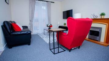 Apartment | Living room | 30-inch TV with digital channels