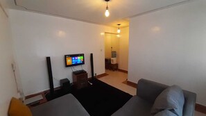 Comfort Apartment | Living area | 14-inch Smart TV with digital channels, TV