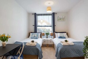 2 bedrooms, desk, iron/ironing board, travel crib