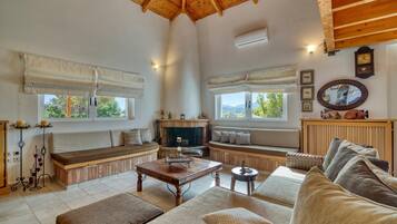 Family Villa, Multiple Bedrooms (Villa John Dimeon Kato Achaia With) | Living area | 21-inch TV with cable channels, fireplace