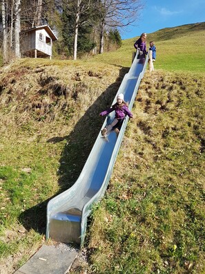 Property grounds - Modern vacation hut in a quiet, secluded location at the foot of the Hirschberg, with terrace (Bizau)