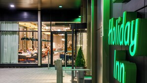 A Holiday Inn sign with a modern design. - Holiday Inn Manchester Airport by IHG (Manchester)