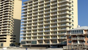 A high-rise hotel with multiple balconies and a beachside location. - Saltwater+Sunsets: 2 King bdrms/2ba Oceanfront Escape Awaits! (Gulf Shores)