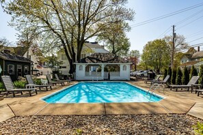 A rectangular swimming pool with lounge chairs and a gazebo in a backyard setting. - Old Plat Homestead -pool & walk to beach (Huron)