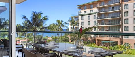 Dine with ocean views, swaying palms, and tropical serenity surrounding.
