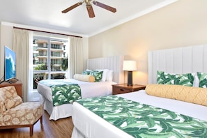 A hotel room with two beds, a ceiling fan, a TV, a chair, and a window with curtains. - Honua Kai | Ocean View 2 BR | Wrap Around Lanai | Car Incl. w/ 6+ Nights | HKK-309 by KBM (Lahaina)