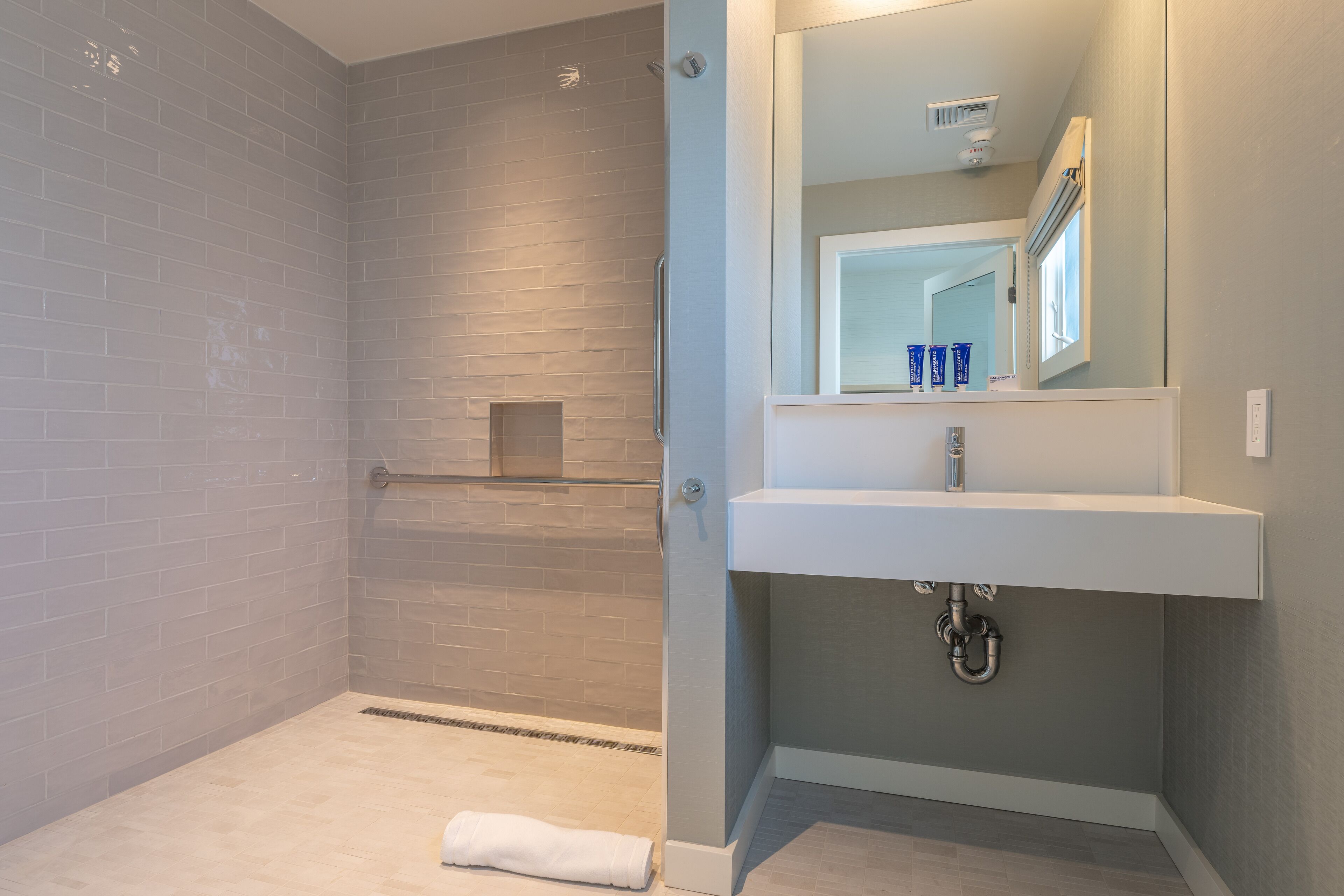 accessible garden suite king | bathroom | shower, rainfall showerhead, hair dryer, dressing gowns