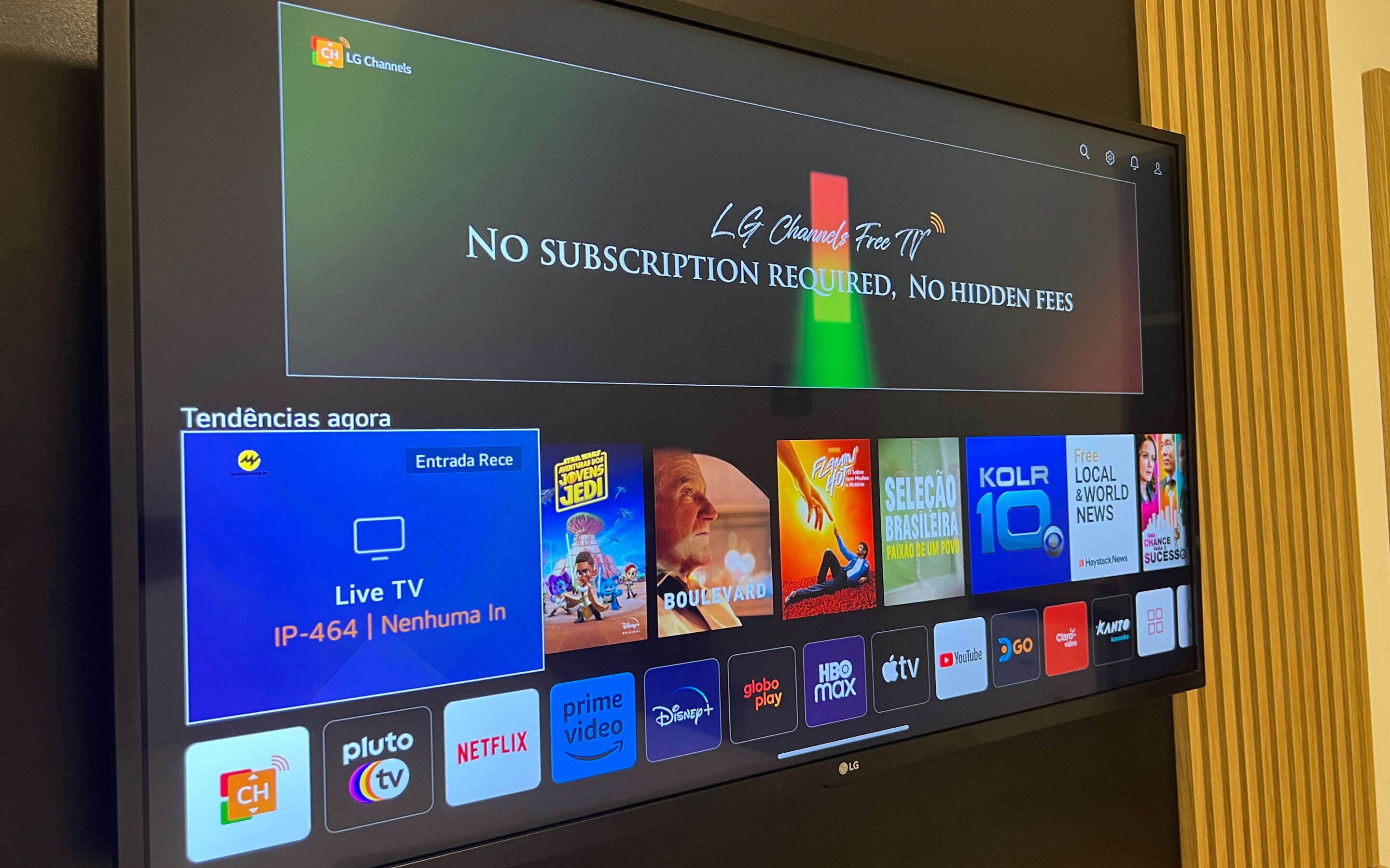 A TV screen displaying a streaming service interface with various content options.