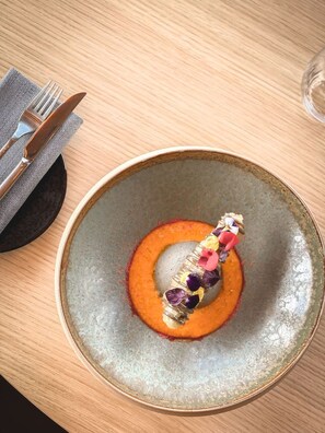 A plate with a dessert on a wooden table. - Villars Palace (Ollon)