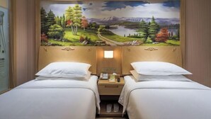 A hotel room with two beds, a mural of a landscape, and a small desk with a phone and a lamp. - Vienna Hotel (Shanghai Hongmei South Road) (Shanghai)