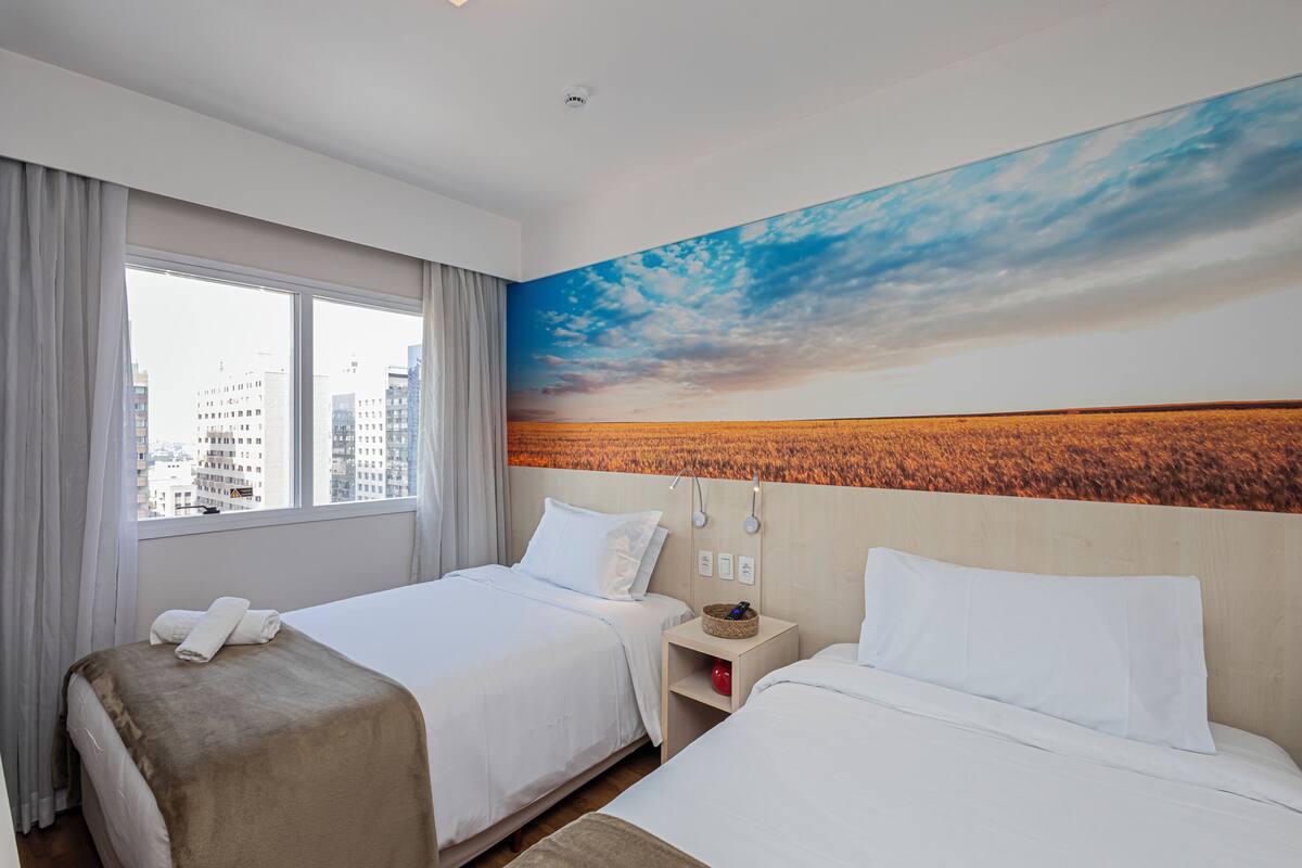 Deluxe Apartment, City View | Minibar, desk, laptop workspace, blackout drapes