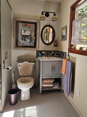 Bathtub, towels, soap, toilet paper