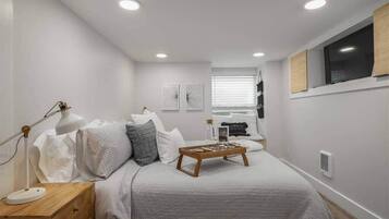 1 bedroom, desk, iron/ironing board, travel crib