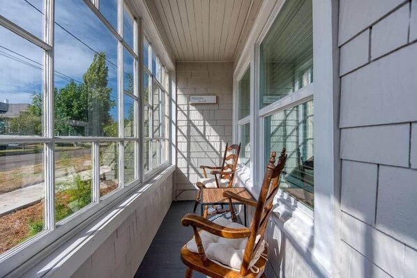 Relax on the porch with a view of the surrounding landscape.