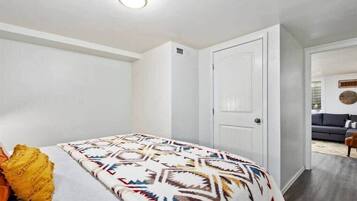 1 bedroom, desk, iron/ironing board, travel crib