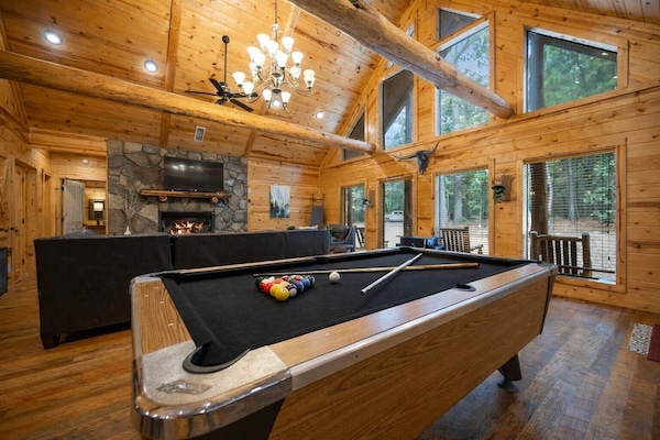 Laughter echoes through the cabin as the fire crackles and someone yells, “One more game!” Between the pool table, pub table, and arcade machine. This is where memories are made.