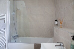 Combined shower/tub, hair dryer, towels, soap