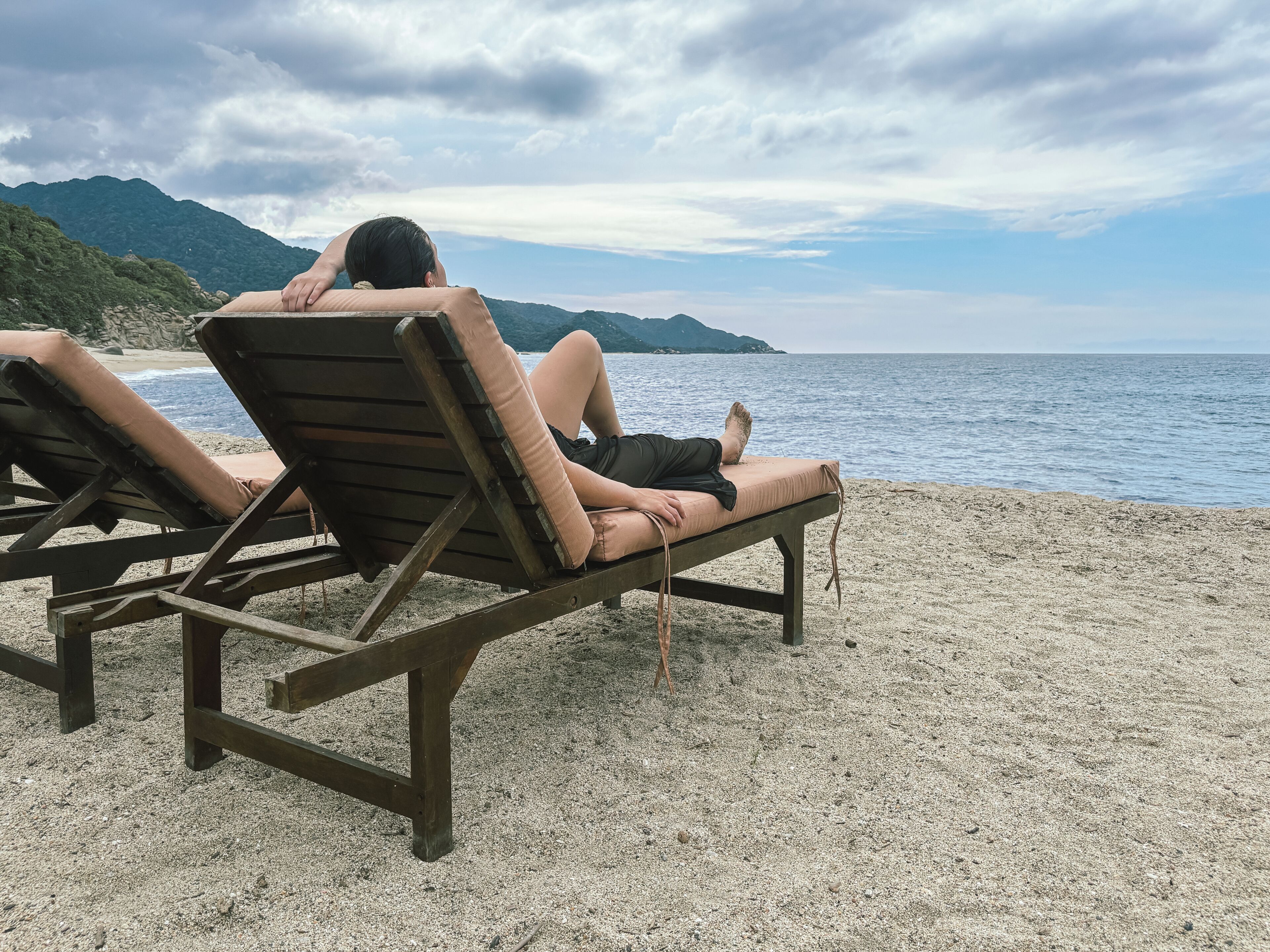 On the beach, white sand, sun-loungers, beach umbrellas