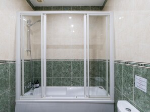 Bathtub, eco-friendly toiletries, hair dryer, towels