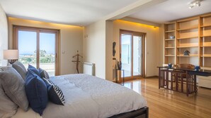 A bedroom with a large bed, a desk, and a chair, a view of the outdoors, and a bookshelf. - Estoril Queen's Apartment by CadenzaLux (Estoril)