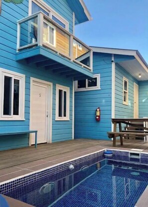 Enjoy a patio with a pool and covered deck.