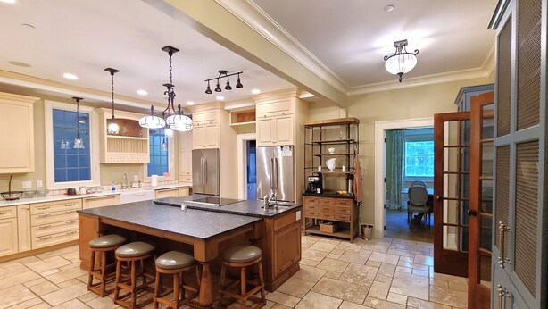 A spacious kitchen with a large island, bar stools, stainless steel appliances, and pendant lighting. - Oversized Country house, Quiet Retreat & Gathering space ~NEW !!!  (Ulster Park)