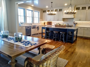 Enjoy meals and casual gatherings around the central island with bar stools in this well-equipped kitchen.