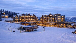 A large lodge with multiple floors and a ski lift in the foreground. - Grand Colorado on Peak 8 Suite - Ski-in/out (Breckenridge)