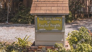 A small library sign at Capital Heights. - Maison Rose - Midcity (Baton Rouge)