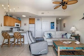 A compact living space with a kitchen, dining area, and seating area.