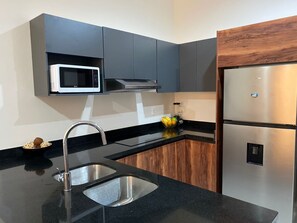 Fridge, microwave, coffee/tea maker, toaster