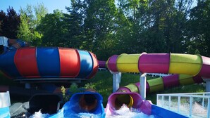 A water park with multiple slides in various colors.
