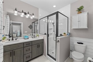 Combined shower/tub, hair dryer, towels, soap