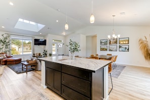 Enjoy cooking in the spacious kitchen with a large island and ample workspace.