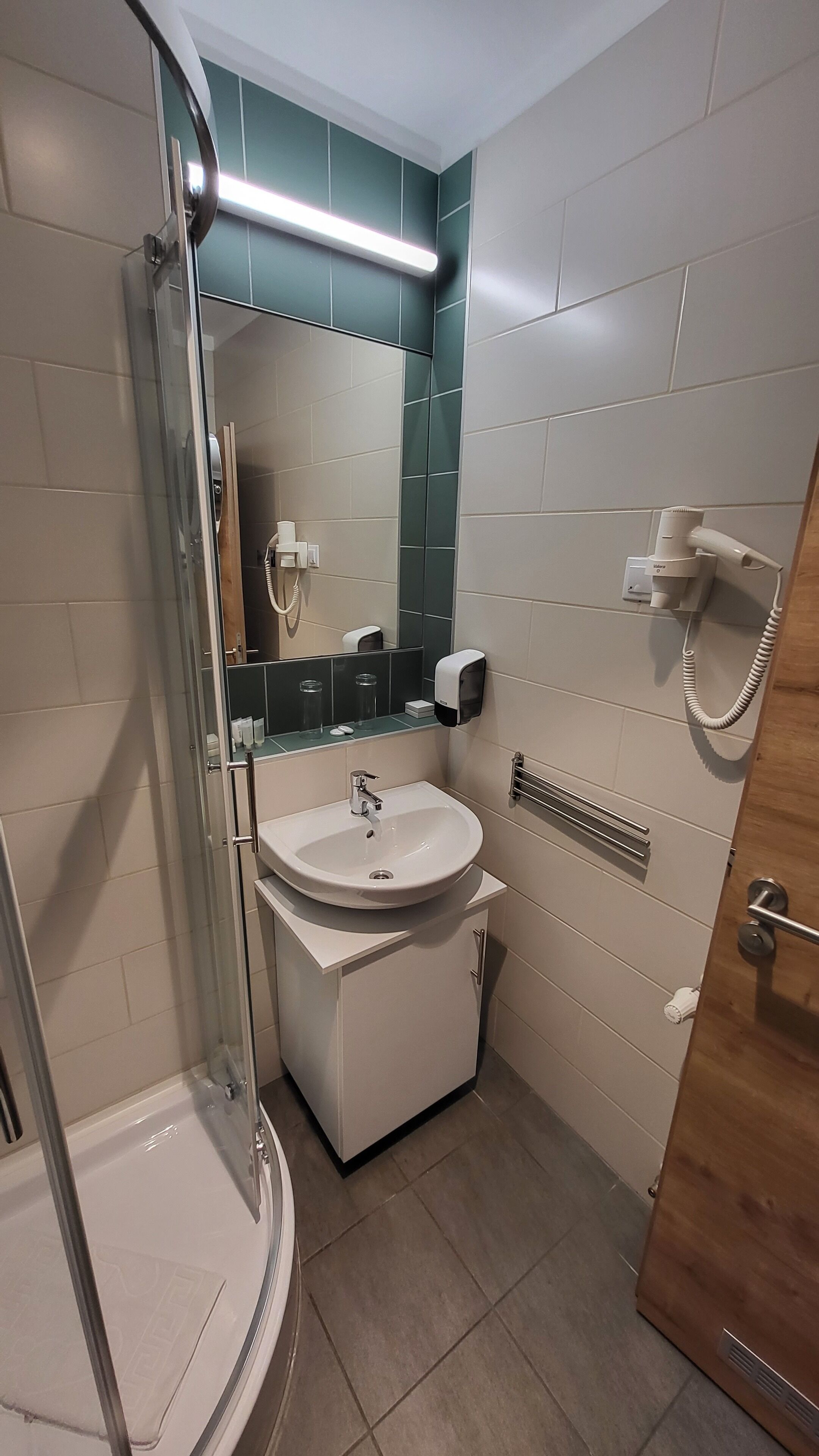 standard double or twin room | bathroom | shower, hair dryer, towels, soap