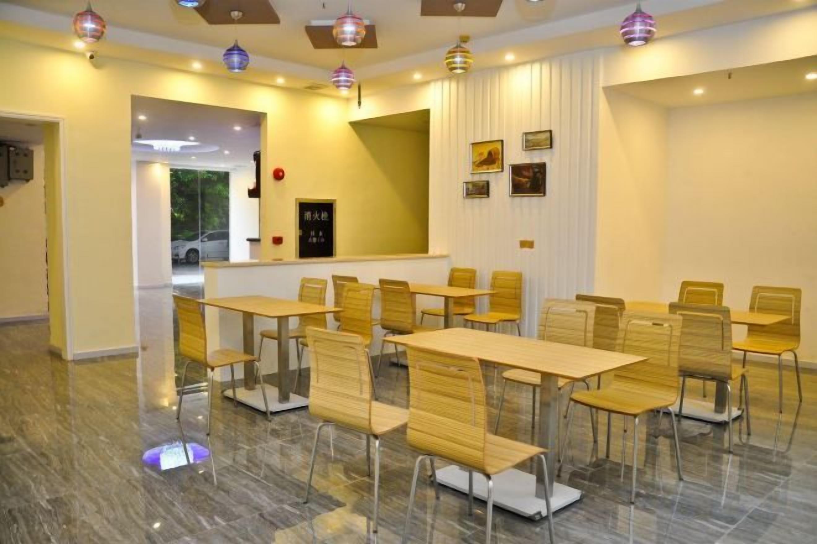 A conference room with tables and chairs arranged for meetings.