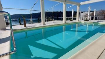 Apartment (One Bedroom apartment with sea view) | Pool | Seasonal outdoor pool, pool umbrellas, sun loungers