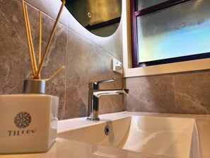 Bathtub, hair dryer, towels