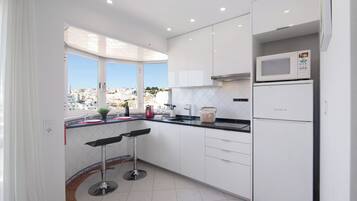 Fridge, microwave, stovetop, coffee/tea maker