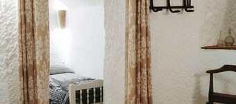 Cave in the most touristic neighborhood of caves in front of the viewpoint.