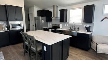 Signature Cabin, 1 King Bed with Sofa bed, Lake View | Private kitchen | Full-size fridge, microwave, oven, stovetop