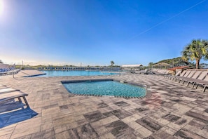 A swimming pool with lounge chairs and a palm tree. - Beach & Pool Access: HHI Resort Condo, Near Golf! (Hilton Head Island)