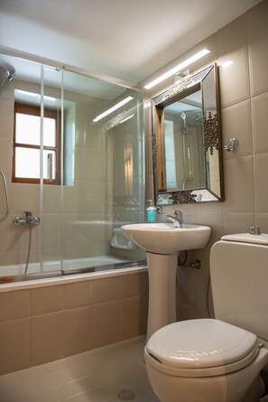 A bathroom with a glass-enclosed shower, a pedestal sink, and a toilet. - Dandy Villas Nymfaio Snowfairy (Amyntaio)