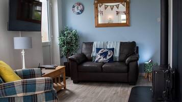 Cottage, Multiple Beds | Living room | 30-inch TV with digital channels, fireplace
