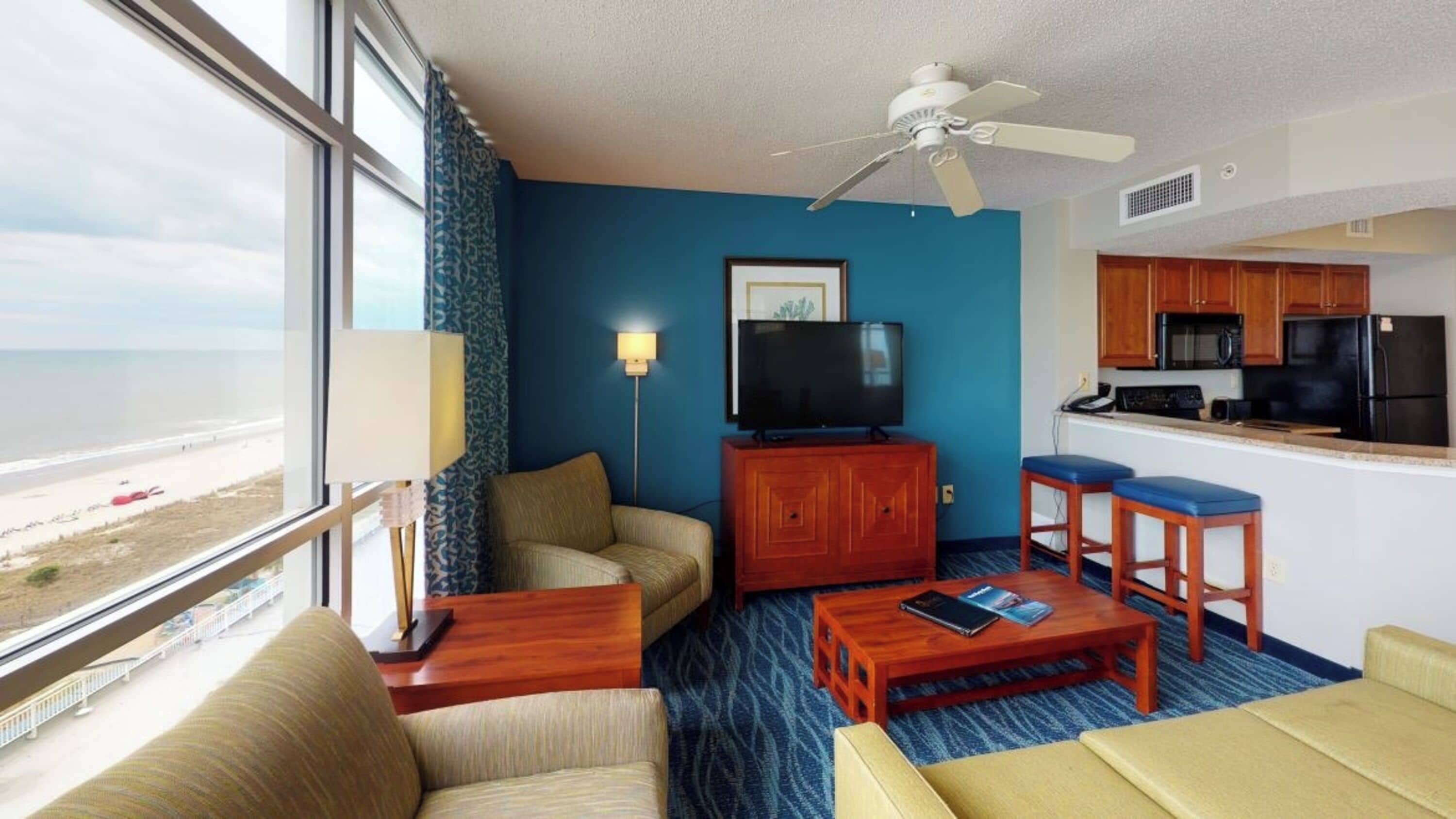 Family Condo, 2 Bedrooms, Balcony, Beachfront | Living room | 50-inch Smart TV with cable channels, TV, table tennis