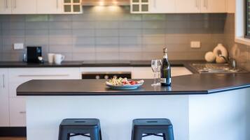 Microwave, dishwasher, high chair, dining tables