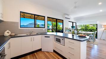 Microwave, dishwasher, high chair, dining tables