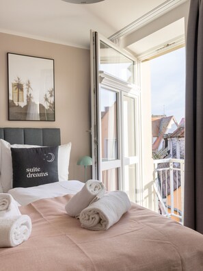 Two-Bedroom Duplex Suite with Balcony | Premium bedding, individually decorated, individually furnished, desk