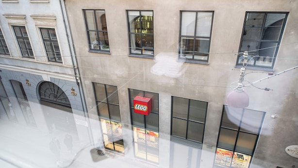 A building with multiple windows and a visible sign that reads "LEGO".